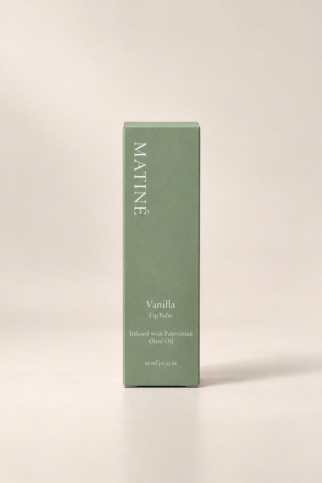MATINÉ Vanilla Lip Balm sage green outer packaging with Palestinian olive oil branding.